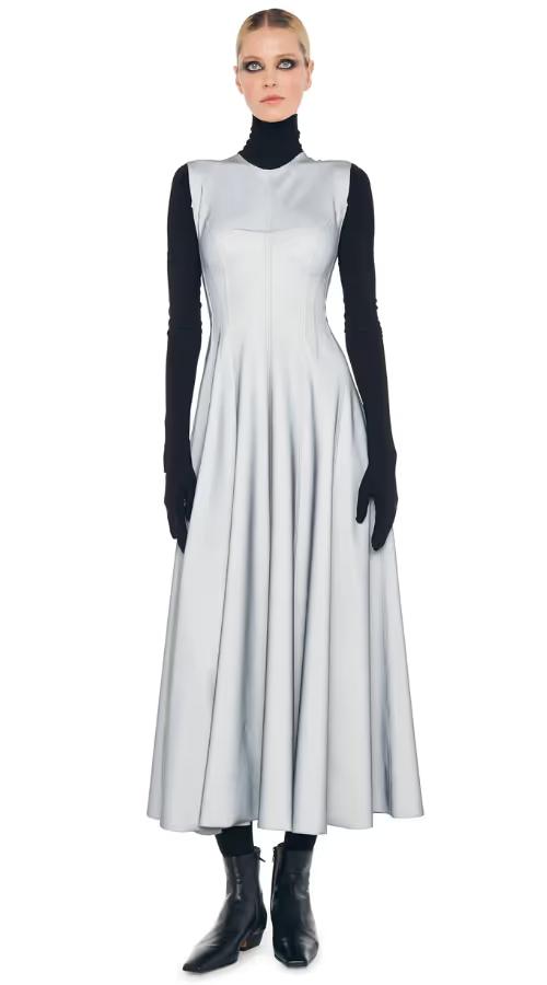 A woman wearing Norma Kamali grey sleeveless long grace dress