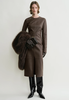 A woman wearing Toteme paneled leather dress bark