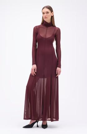 A woman wearing REMAIN BIRGER CHRISTENSEN winetasting color maxi mesh dress bordeaux