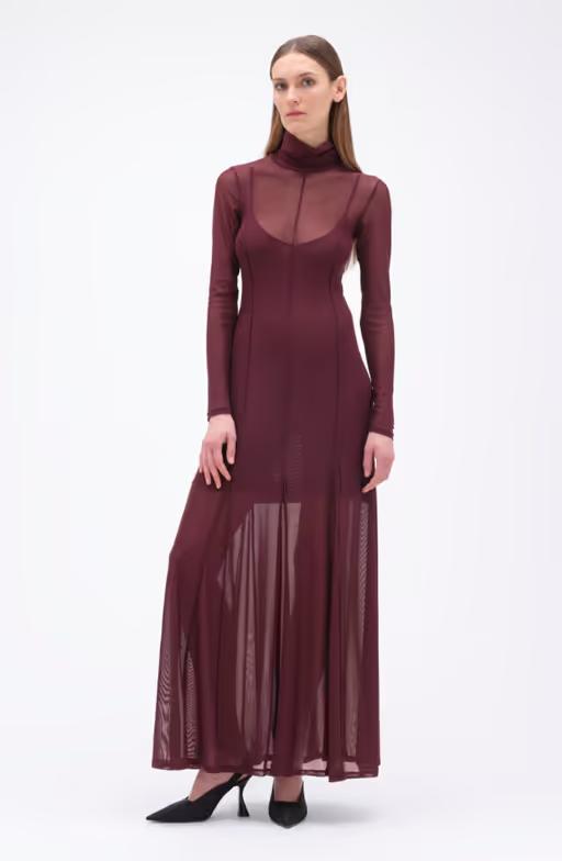 A woman wearing REMAIN BIRGER CHRISTENSEN winetasting color maxi mesh dress bordeaux