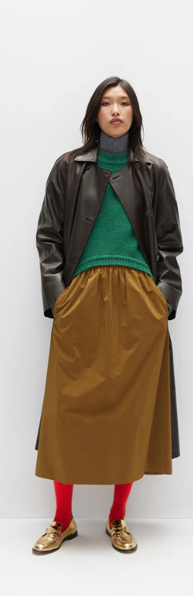 A woman wearing Tibi outfits from Tibi