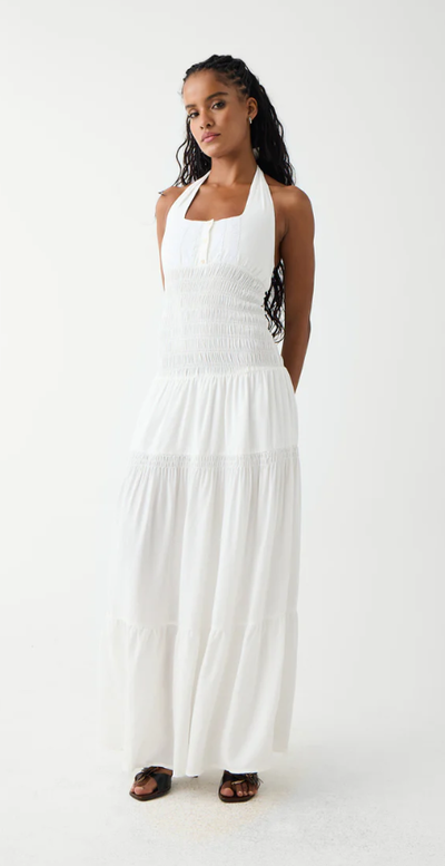 A woman wearing Frankies Bikinis white river halter maxi dress