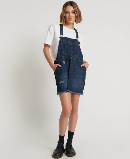 A woman wearing One Teaspoon royal blue mini stanton st dress