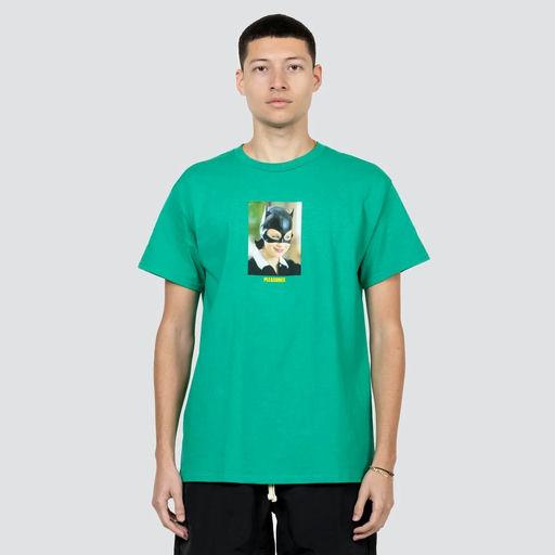 A man wearing a Pleasures green catwoman t-shirt