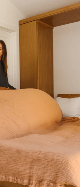 A woman with Sand Cloud lara dusty peach - party blanket™