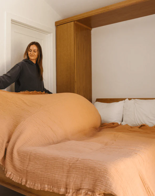A woman with Sand Cloud lara dusty peach - party blanket™
