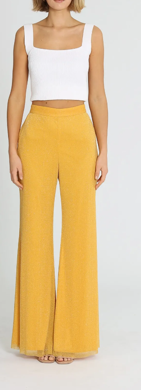 A woman wearing Alice McCall elodie pants - yellow