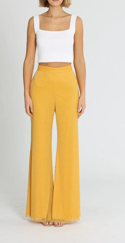 A woman wearing Alice McCall elodie pants - yellow