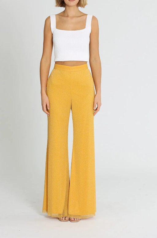 A woman wearing Alice McCall elodie pants - yellow