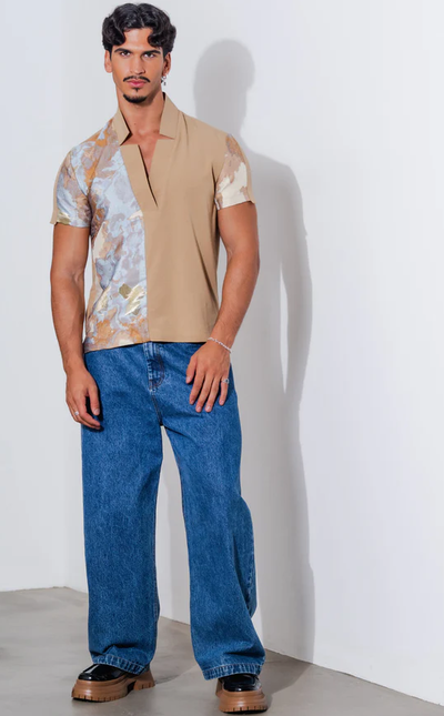 A man wearing orttu star neck shirt couture