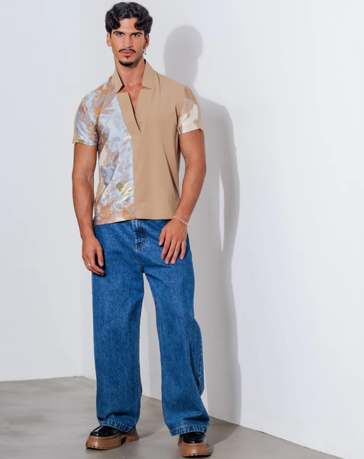A man wearing orttu​ star neck shirt couture