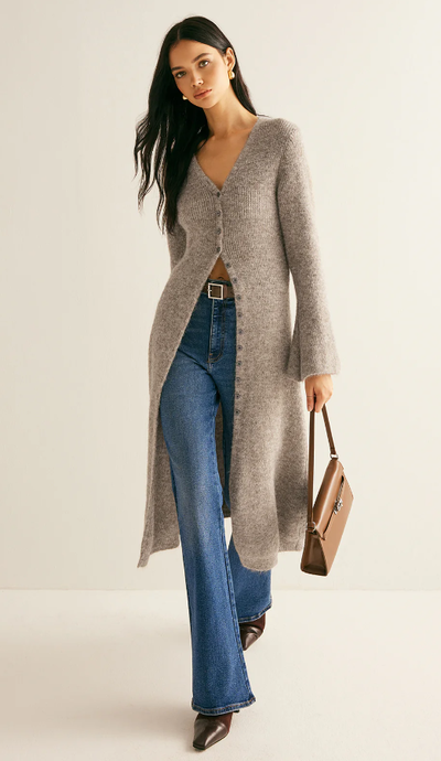 A woman wearing Commense stacking v-neck split breasted sweater dress