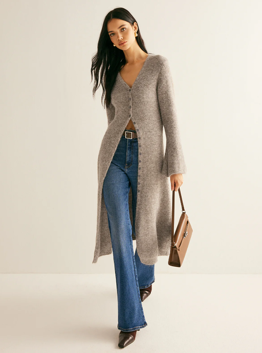 A woman wearing Commense stacking v-neck split breasted sweater dress