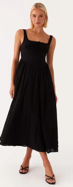A woman wearing peppermayo peppermayo exclusive - pascuelle midi dress - black
