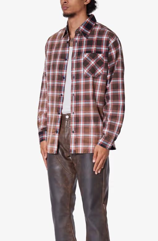 A man wearing mnml​ plaid orange flannel shirt