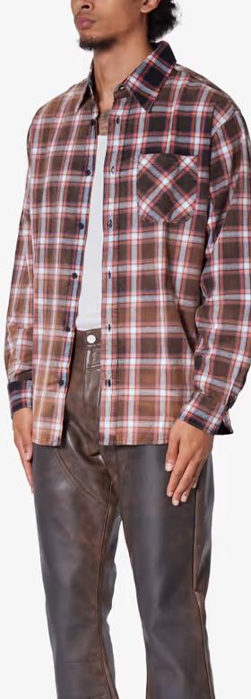 A man wearing mnml plaid orange flannel shirt
