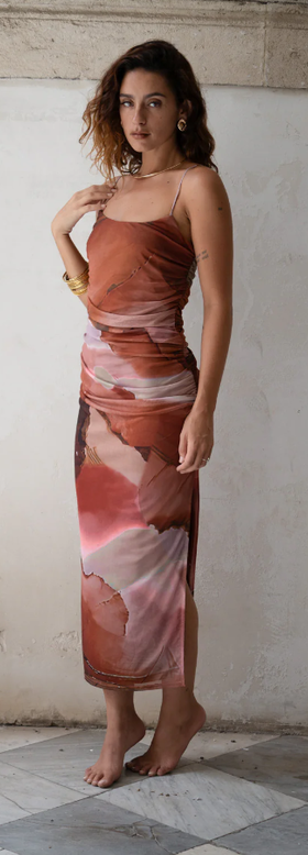 A woman wearing 12 Tribe caterina rust abstract mesh midi dress