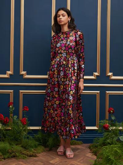A woman wearing Sister Jane dream heir sequin midi dress