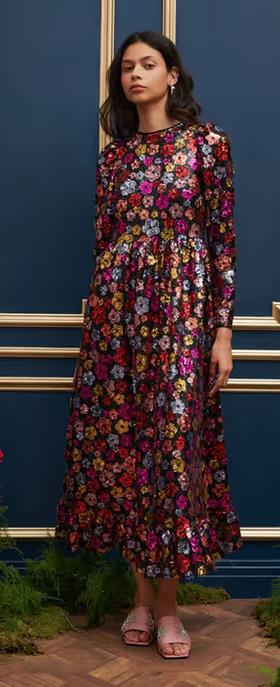 A woman wearing Sister Jane​ dream heir sequin midi dress