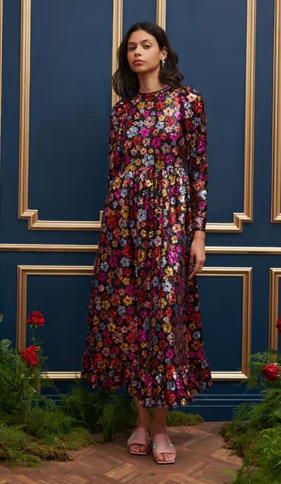 A woman wearing Sister Jane​ dream heir sequin midi dress