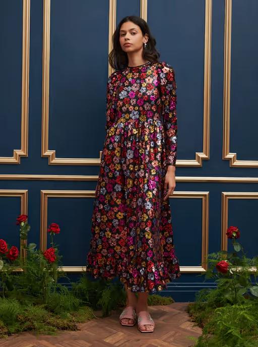 A woman wearing Sister Jane​ dream heir sequin midi dress