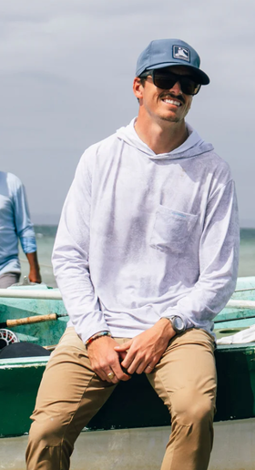 A man wearing Fish Hippie solmar performance hoodie