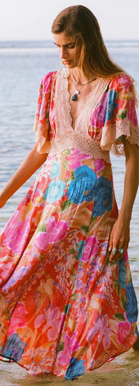 A woman wearing Spell & The Gypsy Collective painter's garden lace maxi dress