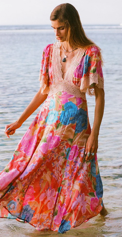 A woman wearing Spell & The Gypsy Collective painter's garden lace maxi dress