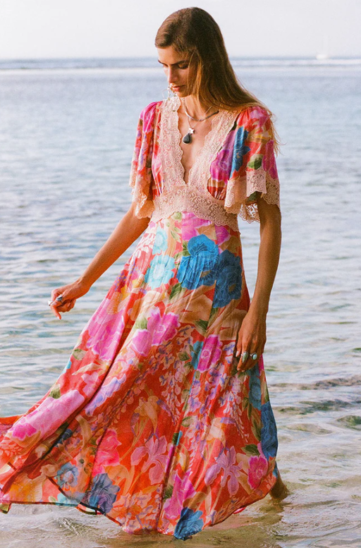 A woman wearing Spell & The Gypsy Collective painter's garden lace maxi dress