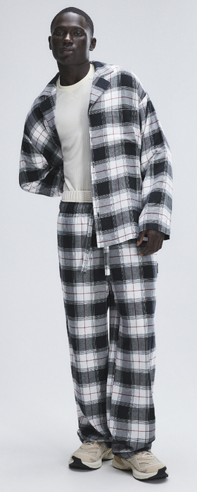 A man wearing Savage x Fenty dove white plaid