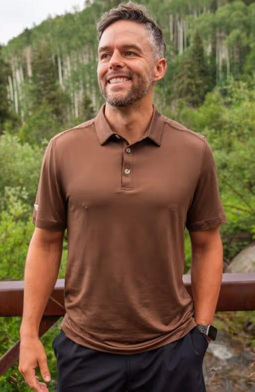 A man wearing BURLEBO performance polo - heather brown