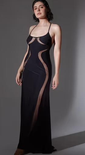 A woman wearing Thistle and Spire​ black psyche slip
