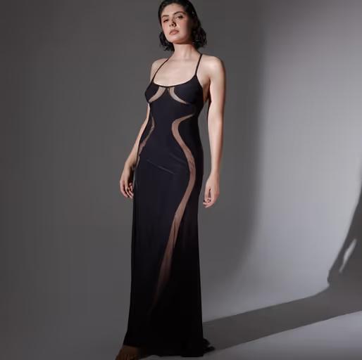 A woman wearing Thistle and Spire​ black psyche slip