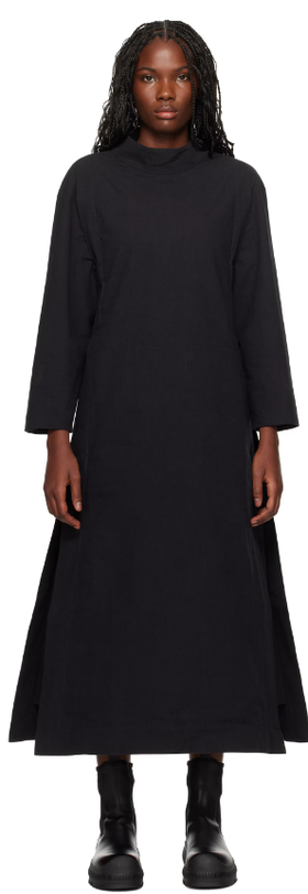 A woman wearing Toogood black 'the scuba diver' midi dress