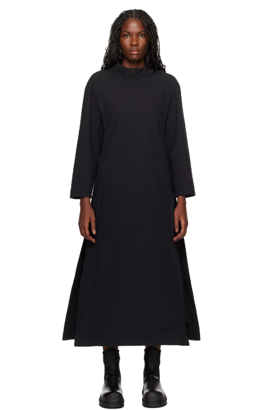 A woman wearing Toogood black 'the scuba diver' midi dress