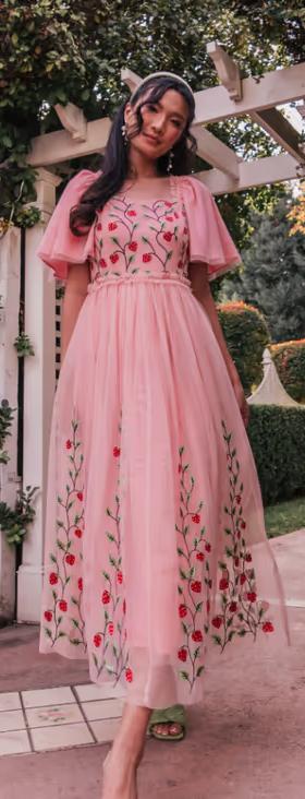 A woman wearing JessaKae berry garden dress