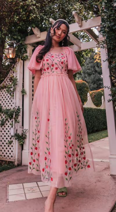A woman wearing JessaKae berry garden dress