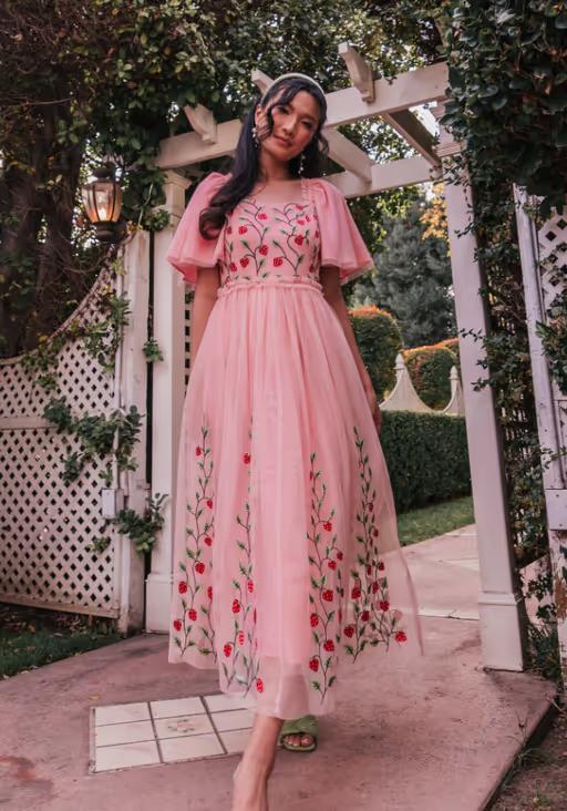 A woman wearing JessaKae berry garden dress