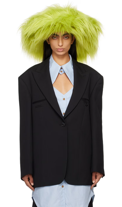 A woman wearing Ruslan Baginskiy green faux-fur fedora