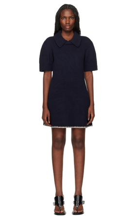 A woman wearing The Garment navy canada minidress