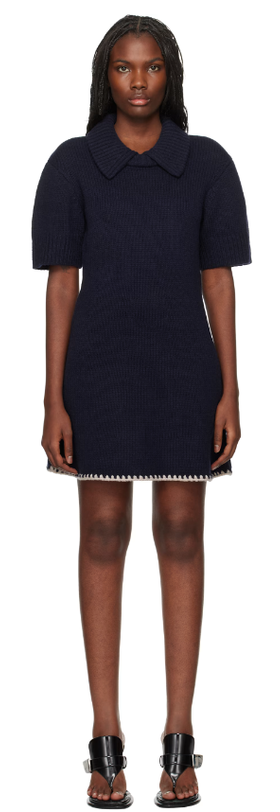 A woman wearing The Garment navy canada minidress