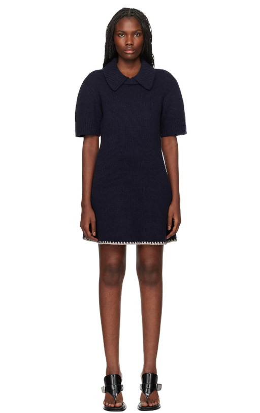 A woman wearing The Garment navy canada minidress