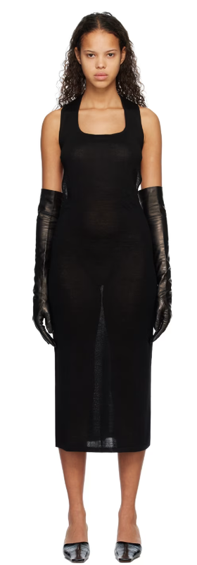 A woman wearing Subtle Le Nguyen black scoop neck midi dress