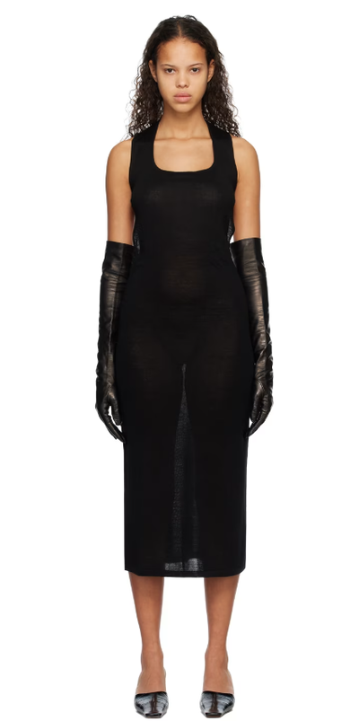A woman wearing Subtle Le Nguyen black scoop neck midi dress