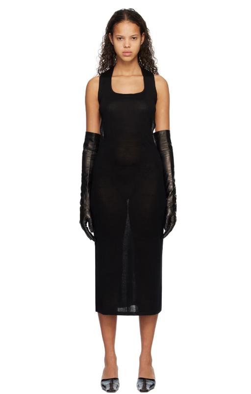 A woman wearing Subtle Le Nguyen black scoop neck midi dress