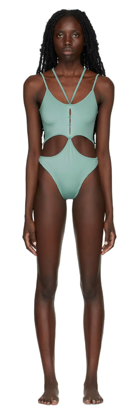 A woman wearing Rui ssense exclusive green one-piece swimsuit