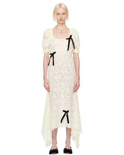 A woman wearing Yuhan Wang off-white puff sleeve midi dress