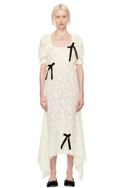 A woman wearing Yuhan Wang off-white puff sleeve midi dress