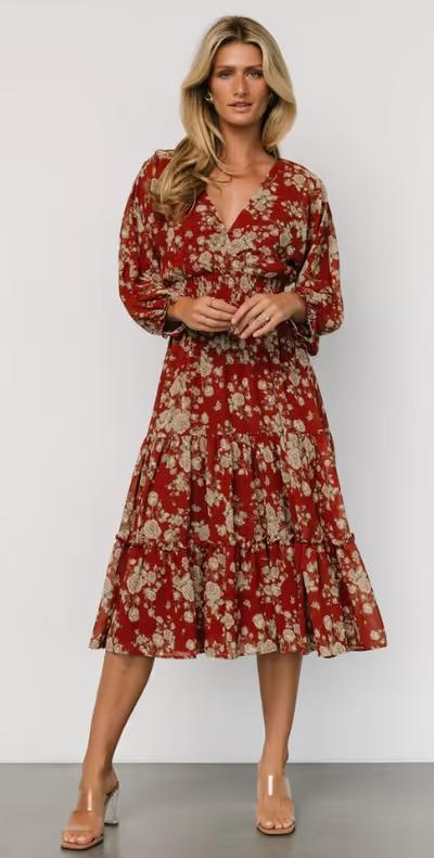 A woman wearing Baltic Born coventry tiered midi dress