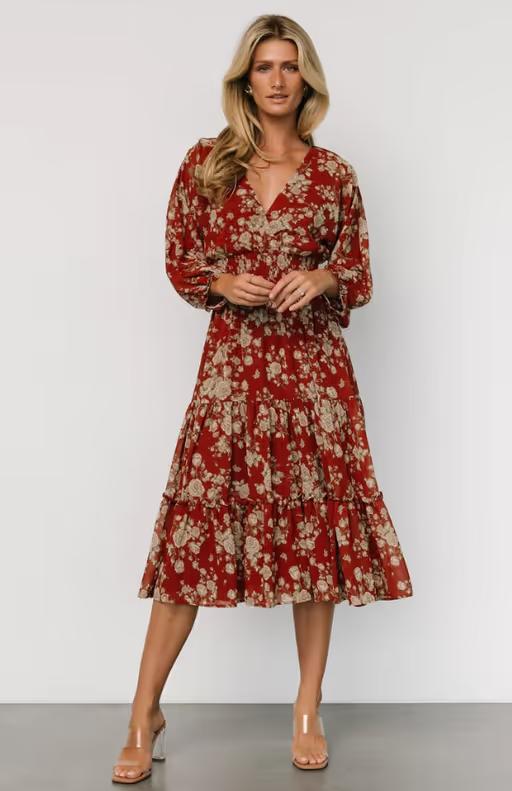 A woman wearing Baltic Born​ coventry tiered midi dress